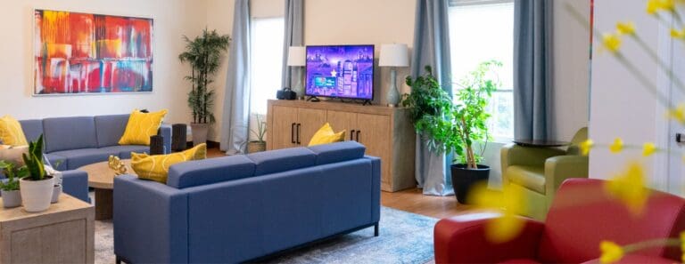 Modern living room at Charlotte Family Housing with colorful decor