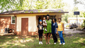 Terri and her family stand in their backyard